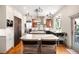 Spacious kitchen with granite countertops, stainless steel appliances, and an island with seating at 3930 S Pinehurst Cir, Denver, CO 80235