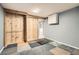 Finished basement featuring a built in closet, tiled flooring and access to other rooms at 7770 Kenwood St, Commerce City, CO 80022