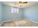 Bedroom featuring plush carpeting, neutral paint, and a ceiling fan at 7770 Kenwood St, Commerce City, CO 80022