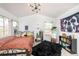 Bright room features large windows and natural lighting to create a welcoming, airy space at 661 Snowberry St, Longmont, CO 80503