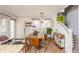 Cozy dining area with wooden floors and a view of the front yard at 661 Snowberry St, Longmont, CO 80503