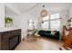 Bright living room with a modern fireplace and comfortable seating, perfect for entertaining at 661 Snowberry St, Longmont, CO 80503