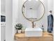 Modern bathroom with floating vanity and circular mirror at 1403 Yates St, Denver, CO 80204