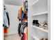 Large walk-in closet, featuring custom shelving and hanging rods at 1403 Yates St, Denver, CO 80204