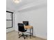 Bright home office featuring a desk and large window at 1403 Yates St, Denver, CO 80204