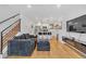 Open concept living room with hardwood floors and modern kitchen at 1403 Yates St, Denver, CO 80204