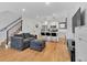 Open concept living room with hardwood floors and modern kitchen at 1403 Yates St, Denver, CO 80204