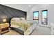 Spacious bedroom with large windows and a geometric accent wall at 1403 Yates St, Denver, CO 80204