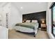 Main bedroom with a view and dark accent wall at 1403 Yates St, Denver, CO 80204