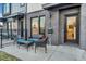 Private patio with seating area, adjacent to townhome entrance at 1403 Yates St, Denver, CO 80204