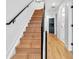 Modern staircase with wood steps and metal railing at 1403 Yates St, Denver, CO 80204