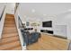 Modern staircase with metal railing leading to upper level at 1403 Yates St, Denver, CO 80204