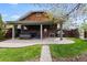 Landscaped backyard featuring a large patio, covered area and a grill at 2601 N Clayton St, Denver, CO 80205