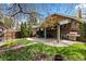 Backyard with a covered patio, and lawn at 2601 N Clayton St, Denver, CO 80205