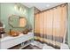 Stylish bathroom featuring dual wood vessel sinks, a patterned shower, and modern fixtures at 2601 N Clayton St, Denver, CO 80205