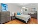 Bright bedroom with hardwood floors, natural light, and neutral paint at 2601 N Clayton St, Denver, CO 80205