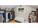 Closet with wooden floors, a window and hanging clothing at 2601 N Clayton St, Denver, CO 80205