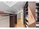 Walk-in closet featuring skylights, wood floors, and custom shelving at 2601 N Clayton St, Denver, CO 80205