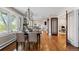 Elegant dining room with chandelier and view of kitchen and office at 2601 N Clayton St, Denver, CO 80205