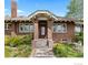 Beautiful brick home with a stately entrance and well-maintained landscaping at 2601 N Clayton St, Denver, CO 80205
