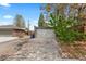 Garage with a driveway and trees nearby at 2601 N Clayton St, Denver, CO 80205