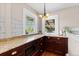 Bright breakfast nook with custom cabinets, granite countertop, and natural light at 2601 N Clayton St, Denver, CO 80205