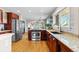 Modern kitchen with stainless steel appliances, granite countertops, and seamless transition to the dining area at 2601 N Clayton St, Denver, CO 80205