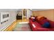 Bright living room featuring hardwood floors, skylights, and a comfy couch at 2601 N Clayton St, Denver, CO 80205