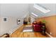 Living room with hardwood floors, skylights, and a modern fireplace at 2601 N Clayton St, Denver, CO 80205
