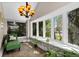 Bright sunroom with large windows and cozy seating at 2601 N Clayton St, Denver, CO 80205