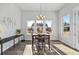 Bright dining room featuring hardwood floors and large windows at 8765 S Quemoy St, Aurora, CO 80016