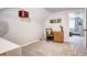 Bedroom featuring a desk with office chair and closet with open door to an adjoining bedroom at 10381 Hondah Dr, Littleton, CO 80127