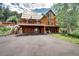 The home features a large deck for entertaining, metal roof, garage, and ample parking space at 10381 Hondah Dr, Littleton, CO 80127