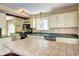 Well-equipped kitchen featuring tiled countertops and backsplash, and ample counter space for cooking at 10381 Hondah Dr, Littleton, CO 80127