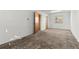 Spacious bedroom with neutral carpet, bright light, and a closet at 15303 E 10Th Ave, Aurora, CO 80011