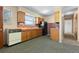 Functional kitchen featuring retro details, wood cabinets, and durable flooring at 15303 E 10Th Ave, Aurora, CO 80011