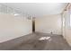 Bright and cozy living room with carpeted floors, a large window, and ample natural light at 15303 E 10Th Ave, Aurora, CO 80011