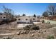 Backyard landscape offering outdoor recreation space and patio area with some trees and clear skies at 9561 W Wesley Dr, Lakewood, CO 80227