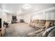 Spacious finished basement with a sectional, games, TV and entertainment area, perfect for relaxation at 9561 W Wesley Dr, Lakewood, CO 80227