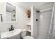 Compact bathroom with a modern sink, toilet, shower and neutral design providing essential amenities at 9561 W Wesley Dr, Lakewood, CO 80227