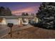 Charming single-story home featuring a well-manicured yard and an attached two-car garage at 9561 W Wesley Dr, Lakewood, CO 80227