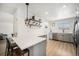 Bright kitchen with modern countertops and stainless steel appliances at 9561 W Wesley Dr, Lakewood, CO 80227