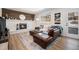 Cozy living room with a fireplace, wood floors, and comfortable seating at 9561 W Wesley Dr, Lakewood, CO 80227