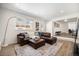 Cozy living room with a fireplace, wood floors, and comfortable seating at 9561 W Wesley Dr, Lakewood, CO 80227
