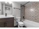 Bathroom with patterned tile in shower/tub area and dark vanity at 14283 Currant St, Broomfield, CO 80020