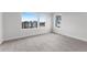 Carpeted bedroom with view of neighborhood buildings at 14283 Currant St, Broomfield, CO 80020
