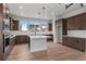 Well-equipped kitchen with stainless appliances, large island, ample countertop space, and stylish pendant lighting at 14283 Currant St, Broomfield, CO 80020