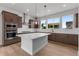 Bright kitchen with a large island, stainless steel appliances, and a view from the big picture windows at 14283 Currant St, Broomfield, CO 80020