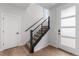 Modern staircase featuring a sleek black railing and carpeted steps at 14283 Currant St, Broomfield, CO 80020