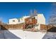 Backyard view of the house showing a deck, fenced yard, and a satellite dish at 137 S Bedford Ave, Castle Rock, CO 80104